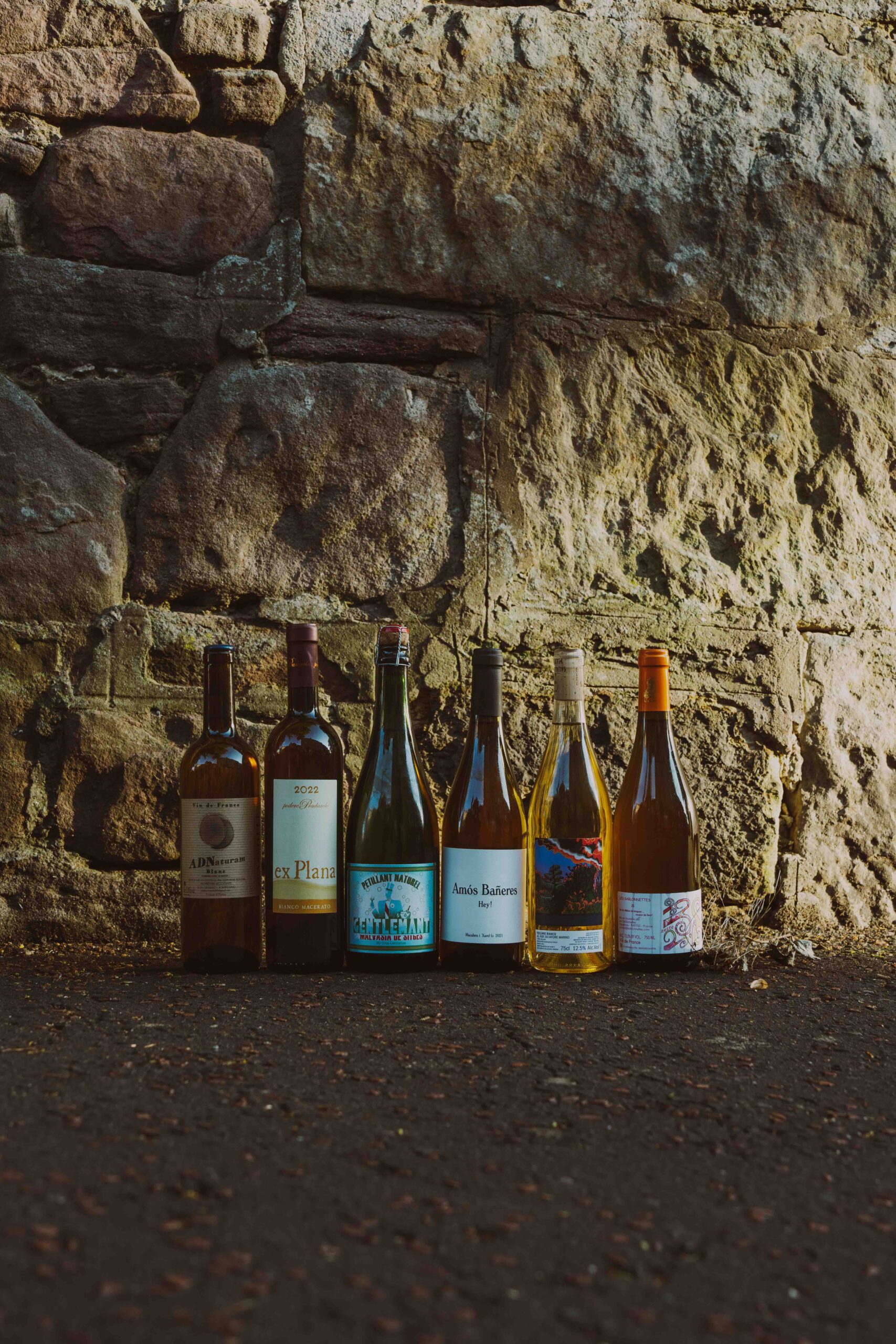 Photo of six bottles of natural wine served at Pomelo Edinburgh Restaurant